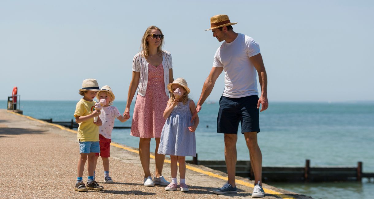 Family enjoying an ice cream on their walk, Isle of Wight UK